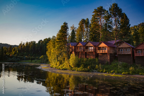 Cozy cabins in the forest near the river