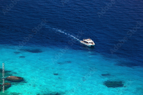 one motorboat in beautiful blue lagoon of Similan islands