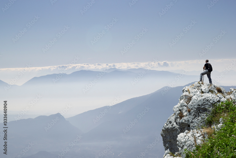 Hiker on the summit of a mountain