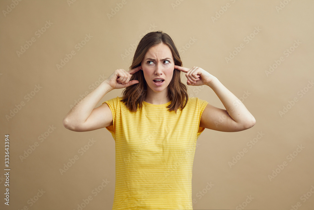frustrated girl sticking fingers in ears concept frustrated girl sticking fingers in ears concept