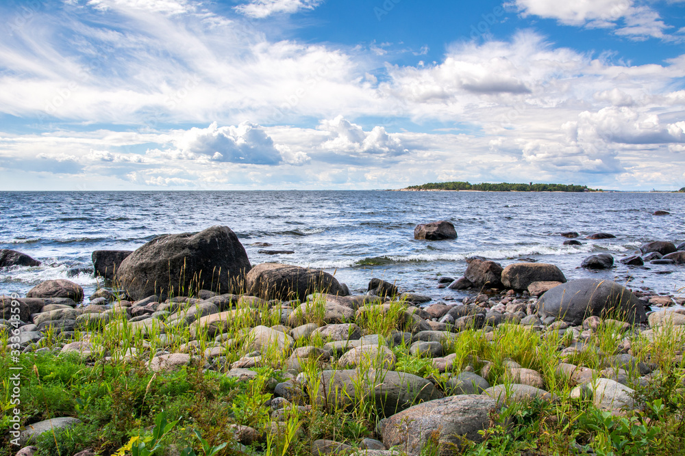 Coastal view of Isosaari island, stones on the shore and Gulf of Finland, Helsinki, Finland Coastal view of Isosaari island, stones on the shore and Gulf of Finland, Helsinki, Finland