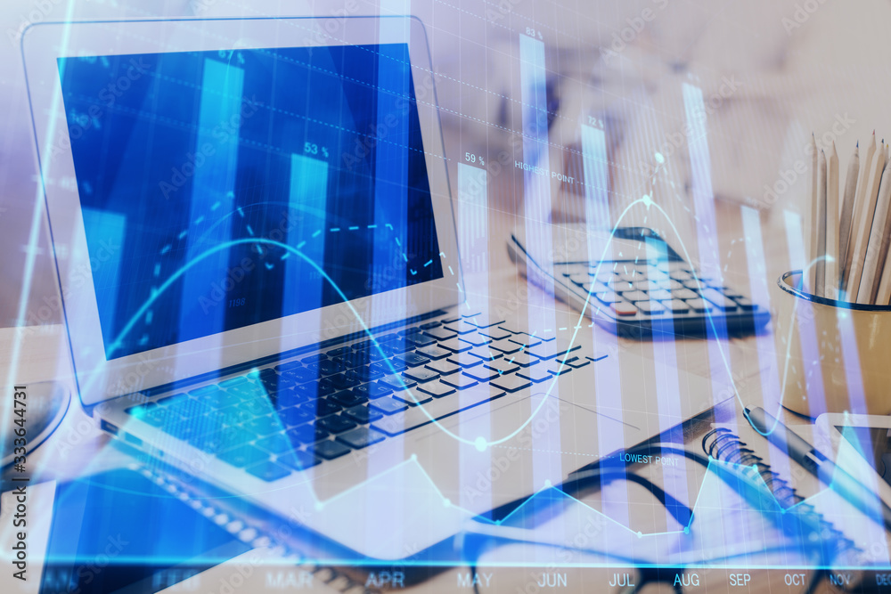 Stock market graph on background with desk and personal computer. Double exposure. Concept of financial analysis. Stock market graph on background with desk and personal computer. Double exposure. Concept of financial analysis.