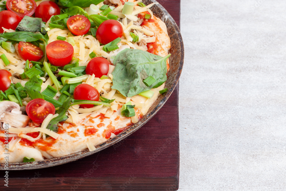 Homemade pizza before baking Homemade pizza before baking