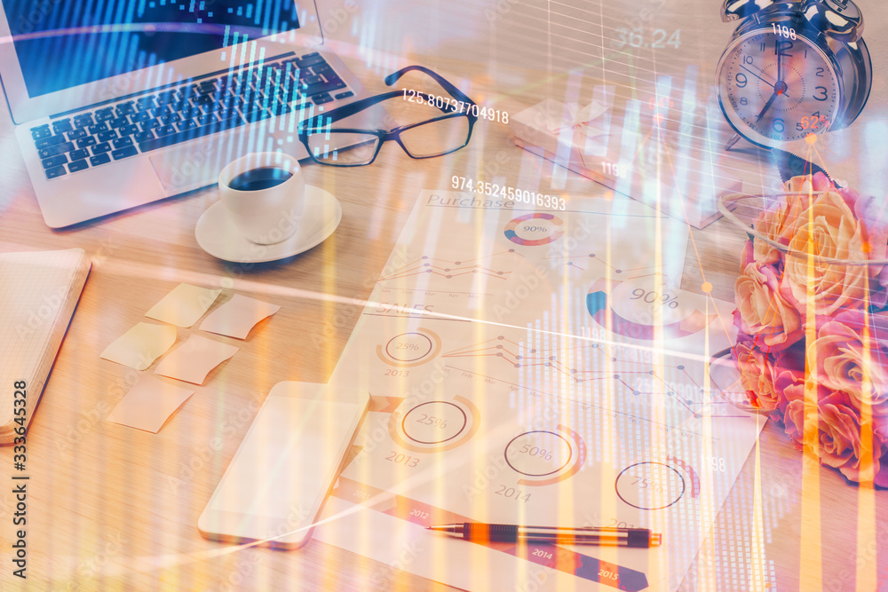 Financial market graph hologram and personal computer on background. Double exposure. Concept of forex. Financial market graph hologram and personal computer on background. Double exposure. Concept of forex.