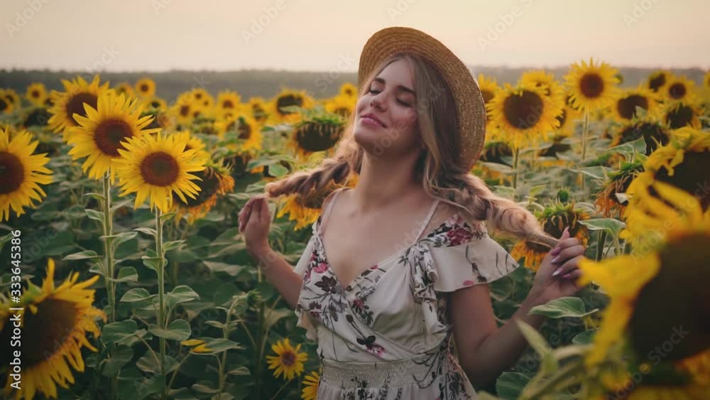Portrait young beautiful rural woman. White sexy dress. Hairstyle blonde two braids. Vintage straw hat. Girl smile enjoy beauty nature. Backdrop blooming yellow sunflower field green leaves blue sky Portrait young beautiful rural woman. White sexy dress. Hairstyle blonde two braids. Vintage straw hat. Girl smile enjoy beauty nature. Backdrop blooming yellow sunflower field green leaves blue sky