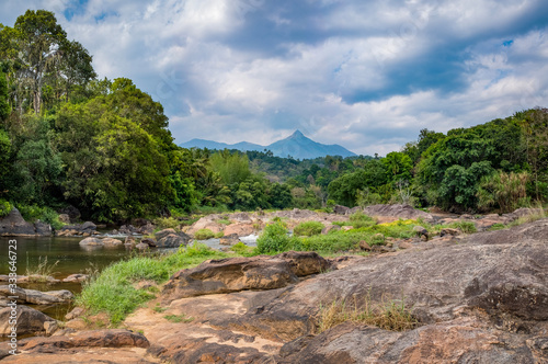 Rocky river and mountain peak, Kerala, India