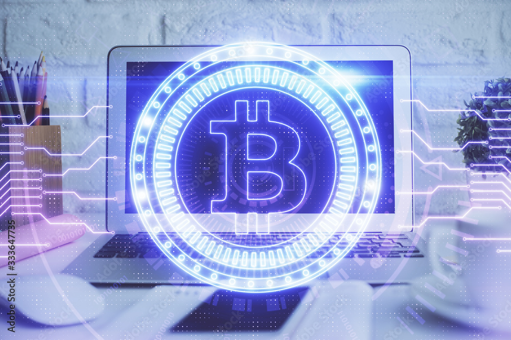Multi exposure of blockchain and crypto economy theme hologram and table with computer background. Concept of bitcoin cryptocurrency. Multi exposure of blockchain and crypto economy theme hologram and table with computer background. Concept of bitcoin cryptocurrency.