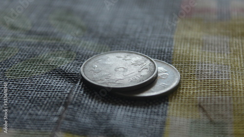 Two rupees coin placed well focused photo