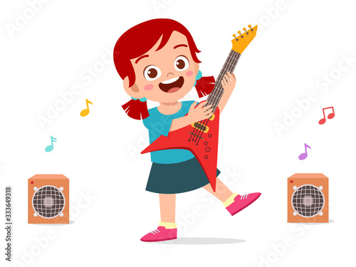 happy cute little kid girl play guitar