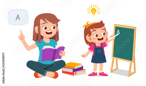 happy cute little kid girl study with mom