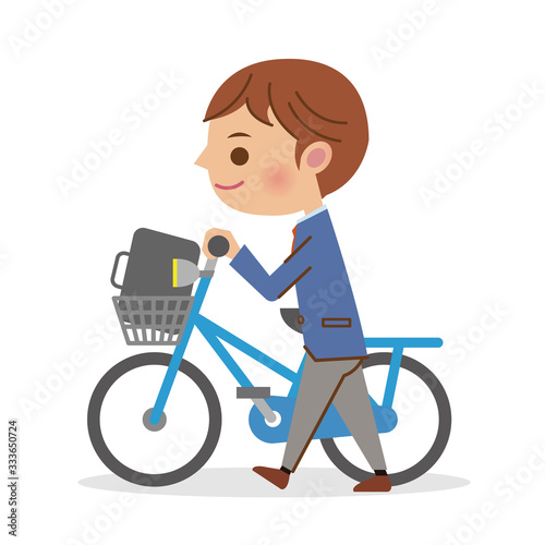 自転車を押し歩きする男子学生