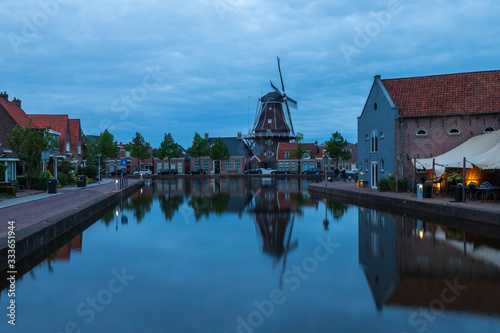 Water canal in Meppel, Holland at sunrise. The background is the sky with clouds. photo