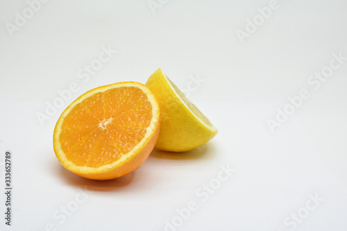 Lemon and orange isolated on white background. 