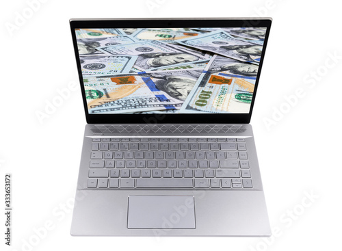 Make money online. Business concept with making profit using internet. Laptop computer with money in woman hands. Making money online concept. Using a laptop to building online business photo