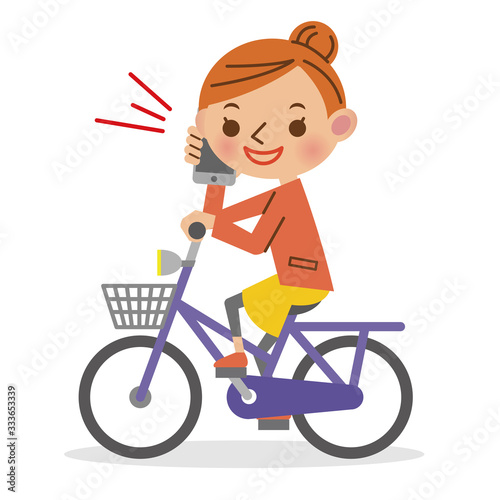 スマートフォンで通話をしながら自転車を運転する女性