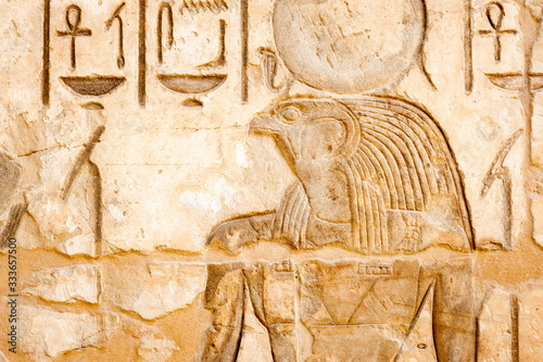 Portrait in hieroglyph of ancient Egyptian falcon god Horus in Edfu, Egypt