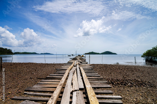 Beautiful rural scenery,wooden jetty over blue sky background at sunny day