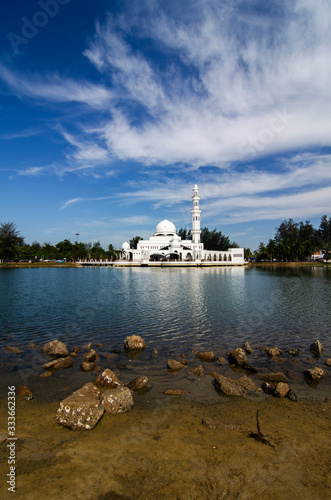 Beautiful floating mosque located in Kuala Ibai, Terengganu Malaysia under bright sunny day photo