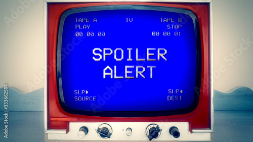 A retro vintage TV showing the text Spoiler Alert, from a damaged VHS double deck tape. Analog capture, intentional heavy distortion.