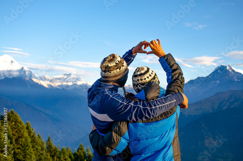 Tourists man and woman on background mountains Himalayas in Nepal  photo