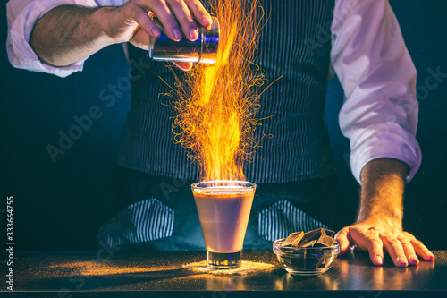 Bartender making a cocktail on fire