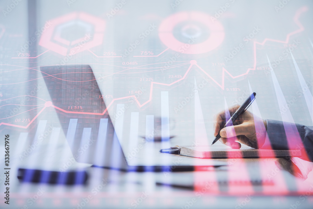 Multi exposure of forex chart with man working on computer on background. Concept of market analysis. Multi exposure of forex chart with man working on computer on background. Concept of market analysis.