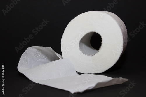 Toilet paper roll close up on black background