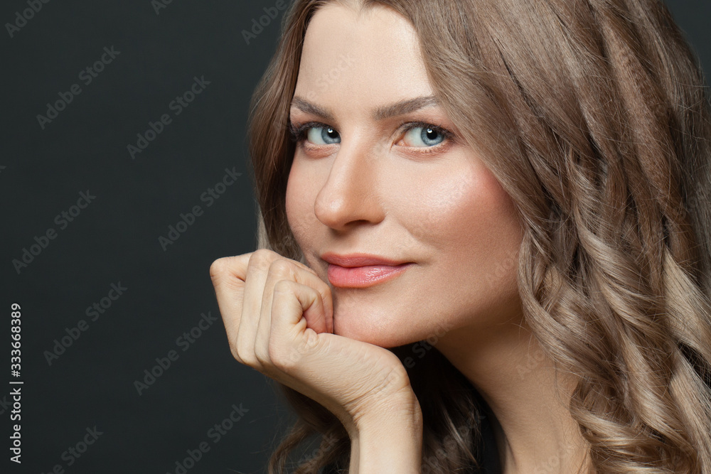 Smiling woman on black, close up female portrait Smiling woman on black, close up female portrait