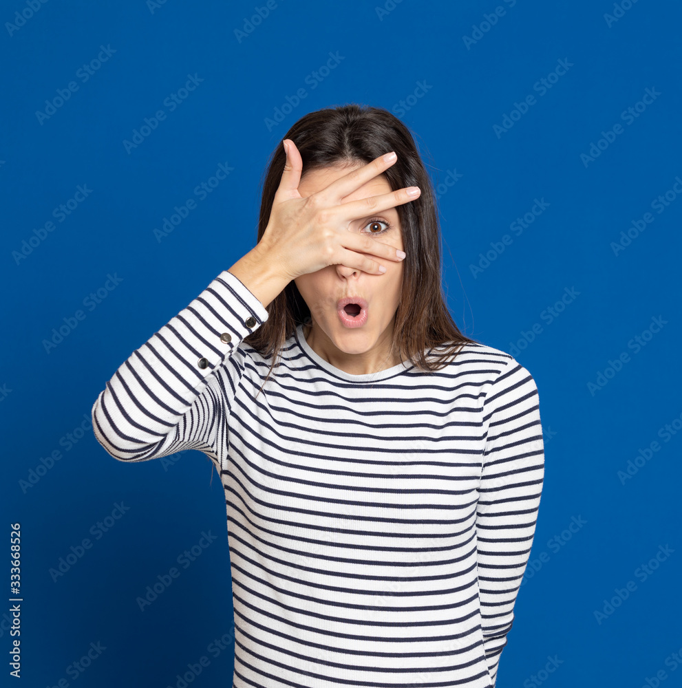 Brunette young woman wearing a striped T-shirt Brunette young woman wearing a striped T-shirt