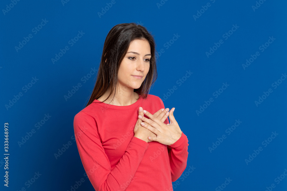 Attractive brunette girl wearing a red T-shirt Attractive brunette girl wearing a red T-shirt