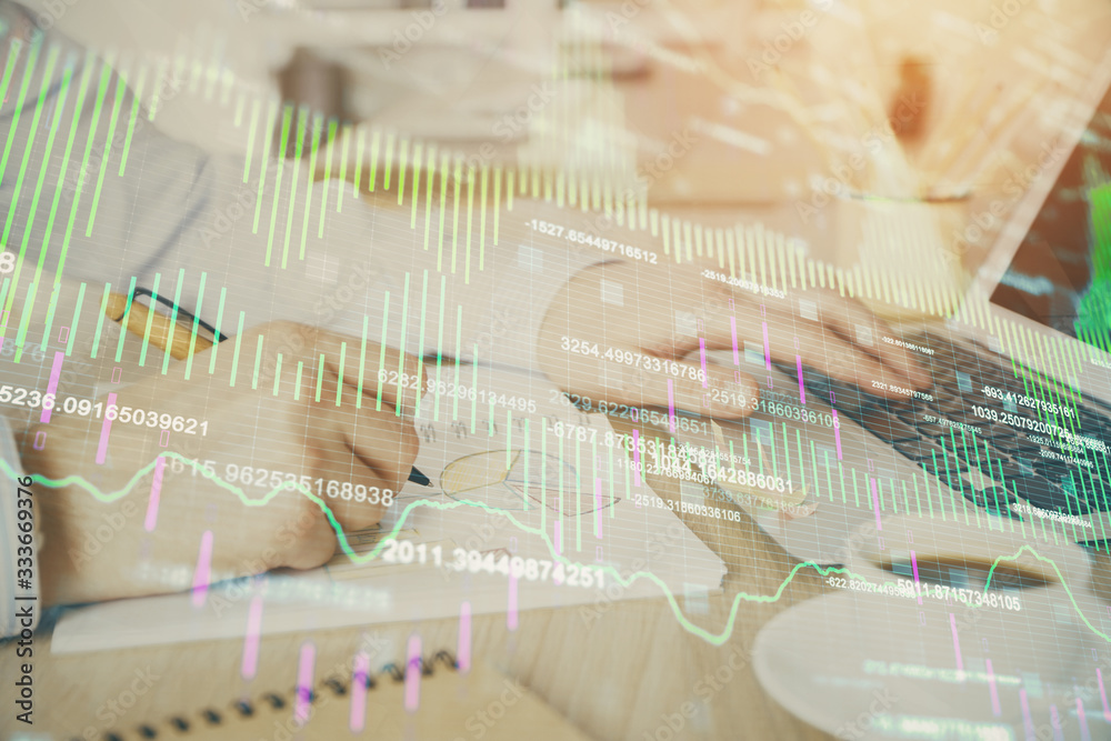 Multi exposure of stock market graph with man working on laptop on background. Concept of financial analysis. Multi exposure of stock market graph with man working on laptop on background. Concept of financial analysis.