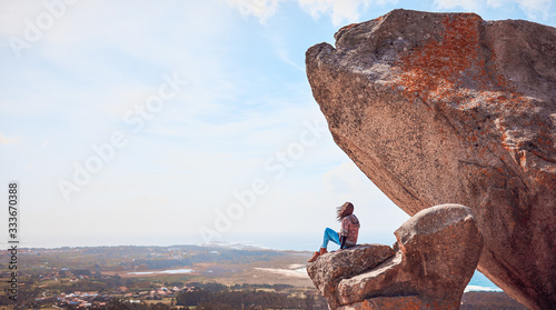 Young woman on the Pedra da Ra viewpoint in Galicia photo