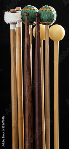 Percussion mallets on black background photo