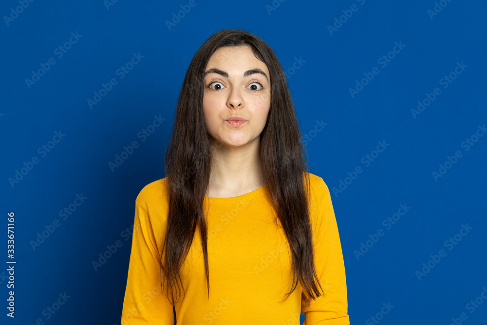 Brunette young girl wearing yellow jersey Brunette young girl wearing yellow jersey