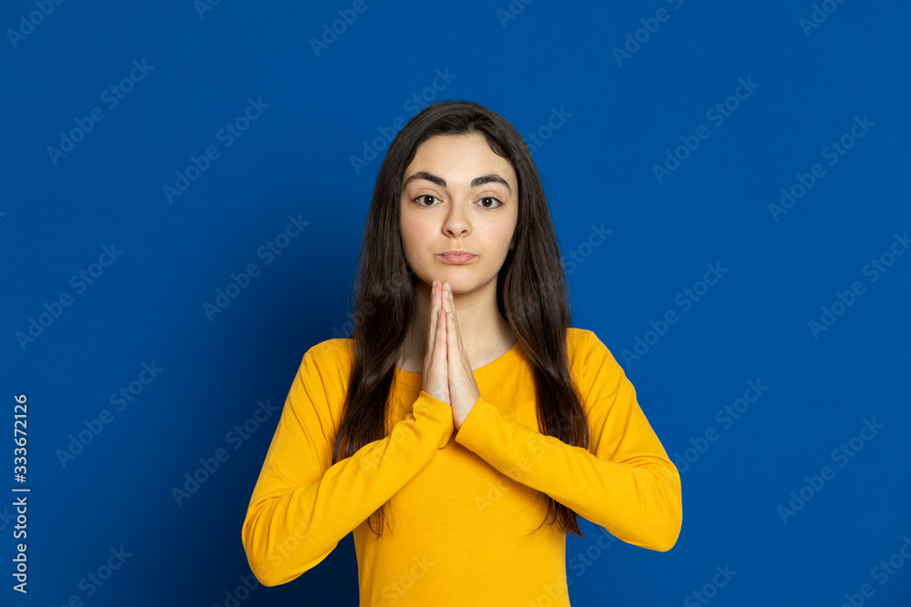Brunette young girl wearing yellow jersey Brunette young girl wearing yellow jersey