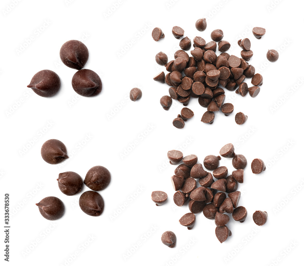 Set of delicious chocolate chips on white background, top view Set of delicious chocolate chips on white background, top view