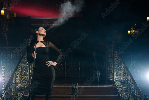 Girl smokes hookah