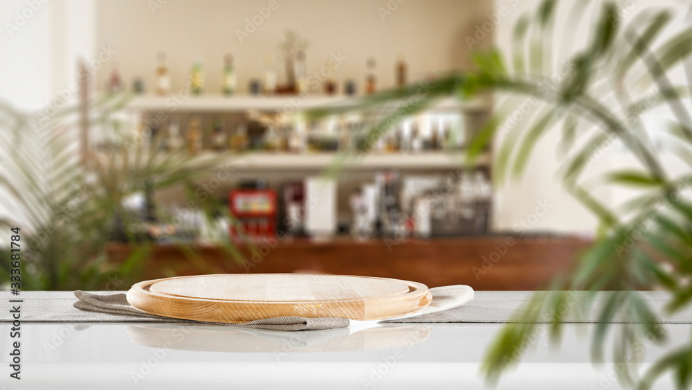Sunny summer day and blurred interior of restaurant with bar. 