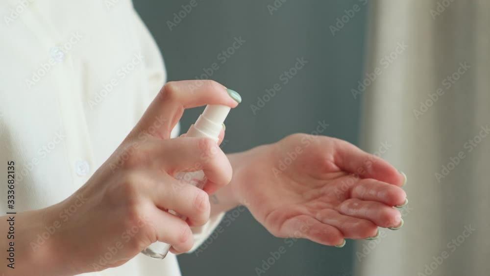 Woman hands using antiseptic spray. COVID-19 Pandemic Coronavir. Protection from bacterias and virus. Clean hands, hygiene and healthcare. Woman hands using antiseptic spray. COVID-19 Pandemic Coronavir. Protection from bacterias and virus. Clean hands, hygiene and healthcare.