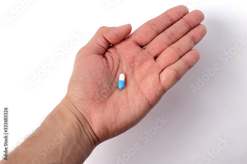 Pill in hand. medicines and vitamins