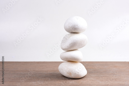 White stones on wooden background