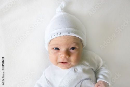 Cute adorable baby child. Happy baby girl on white background and looking at the camera.