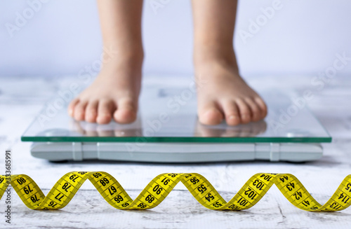 Child measuring weight concept. Close up