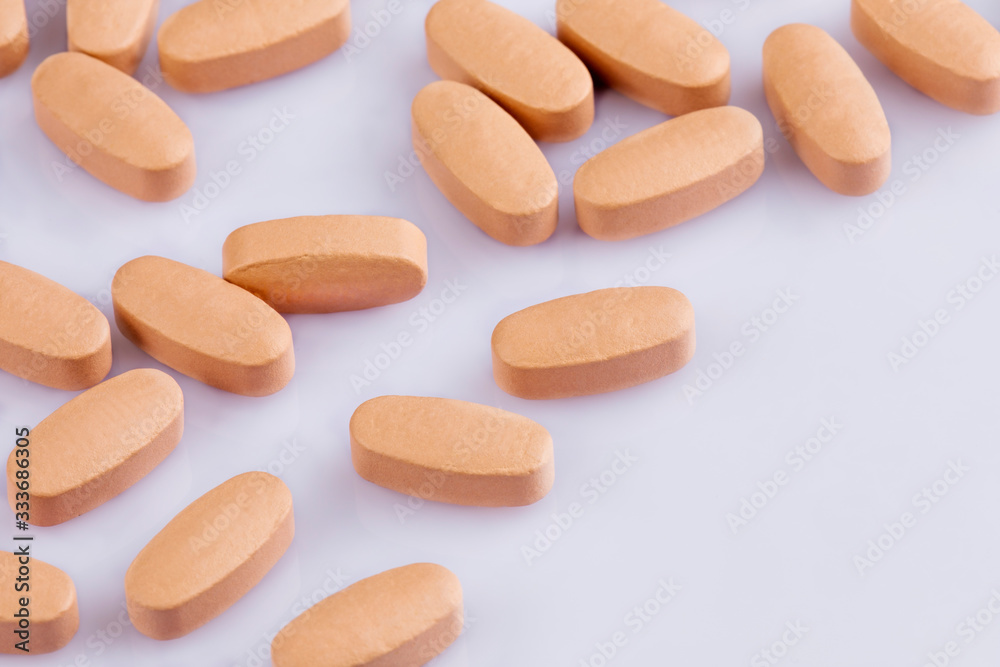 Close up of Multi-Vitamin and mineral on white background Close up of Multi-Vitamin and mineral on white background