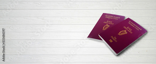 Irish Passports on Wood Lines Bakcground Banner with Copy Space - 3D Illustration