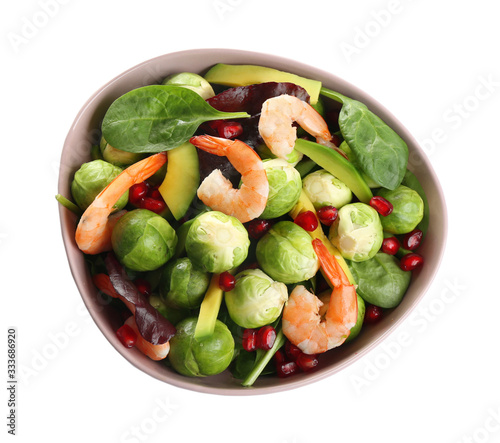 Tasty salad with Brussels sprouts in bowl isolated on white, top view