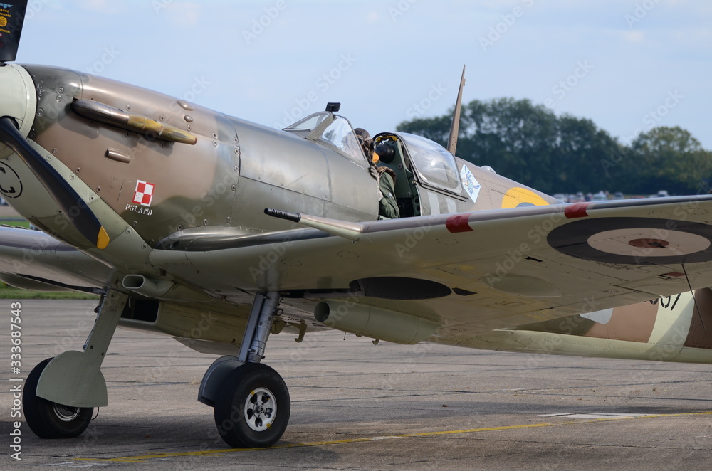 British Royal Air Force (RAF) Merlin Spitfire on runway at Air Show, England, UK British Royal Air Force (RAF) Merlin Spitfire on runway at Air Show, England, UK