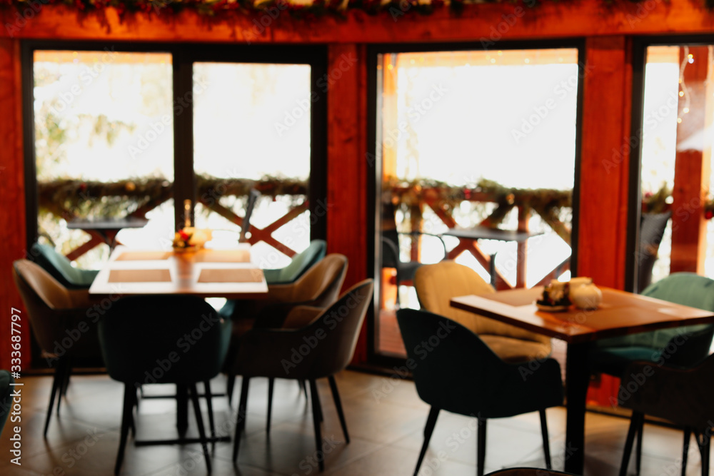 Blurred view of modern cafe interior with new stylish furniture Blurred view of modern cafe interior with new stylish furniture