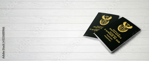South African Passports on Wood Lines Bakcground Banner with Copy Space - 3D Illustration