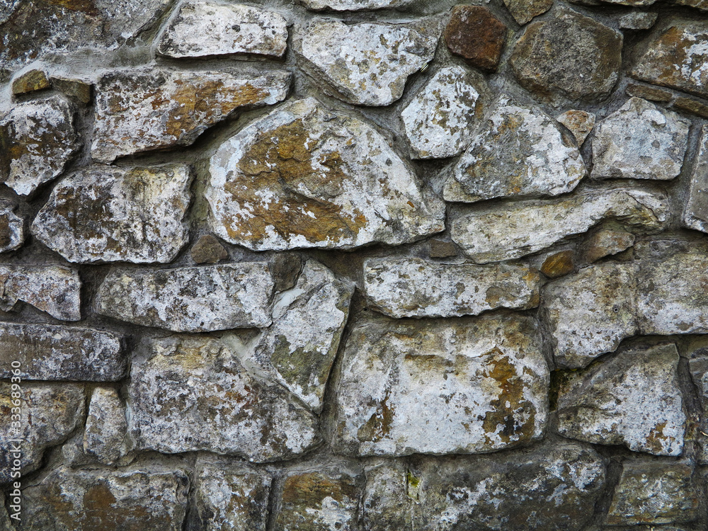 Fototapeta premium texture of stone on wall of different rocks